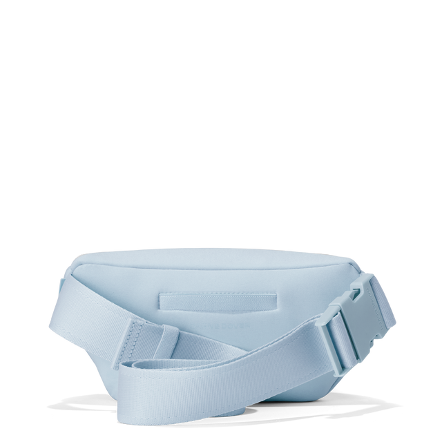 Dagne Dover ace fanny pack in an airy, lighter sky blue seen from the back.
