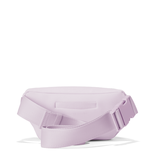 Dagne Dover ace fanny pack in  a soft purple with grey undertones seen from the back.
