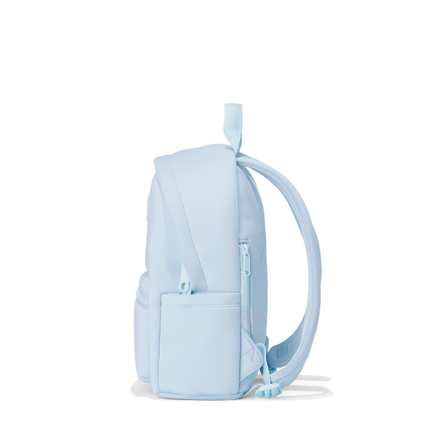Dagne Dover small Dakota Neoprene Backpack in an airy, lighter sky blue seen from the side.
