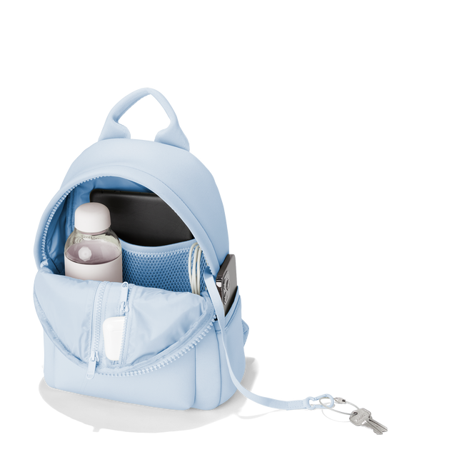 Dagne Dover small Dakota Neoprene Backpack in an airy, lighter sky blue unzipped, showing the interior pockets and shoe bag. hover