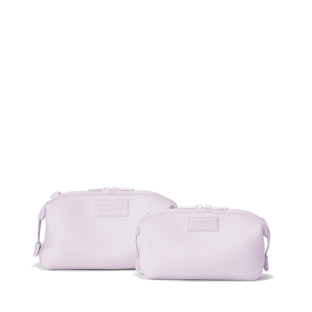 Dagne Dover Small and Large Hunter Toiletry Bags in a soft purple with grey undertones.

