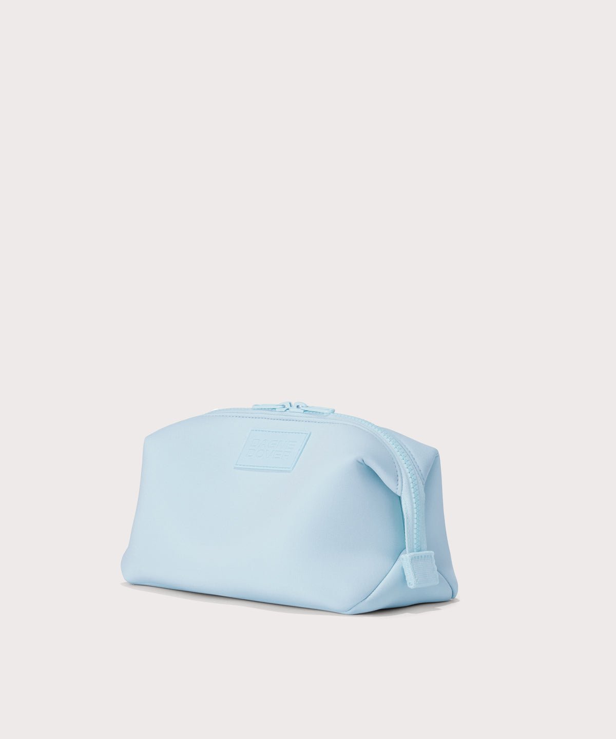 Dagne Dover large Hunter Toiletry Bag in an airy, lighter sky blue seen from an angle.
