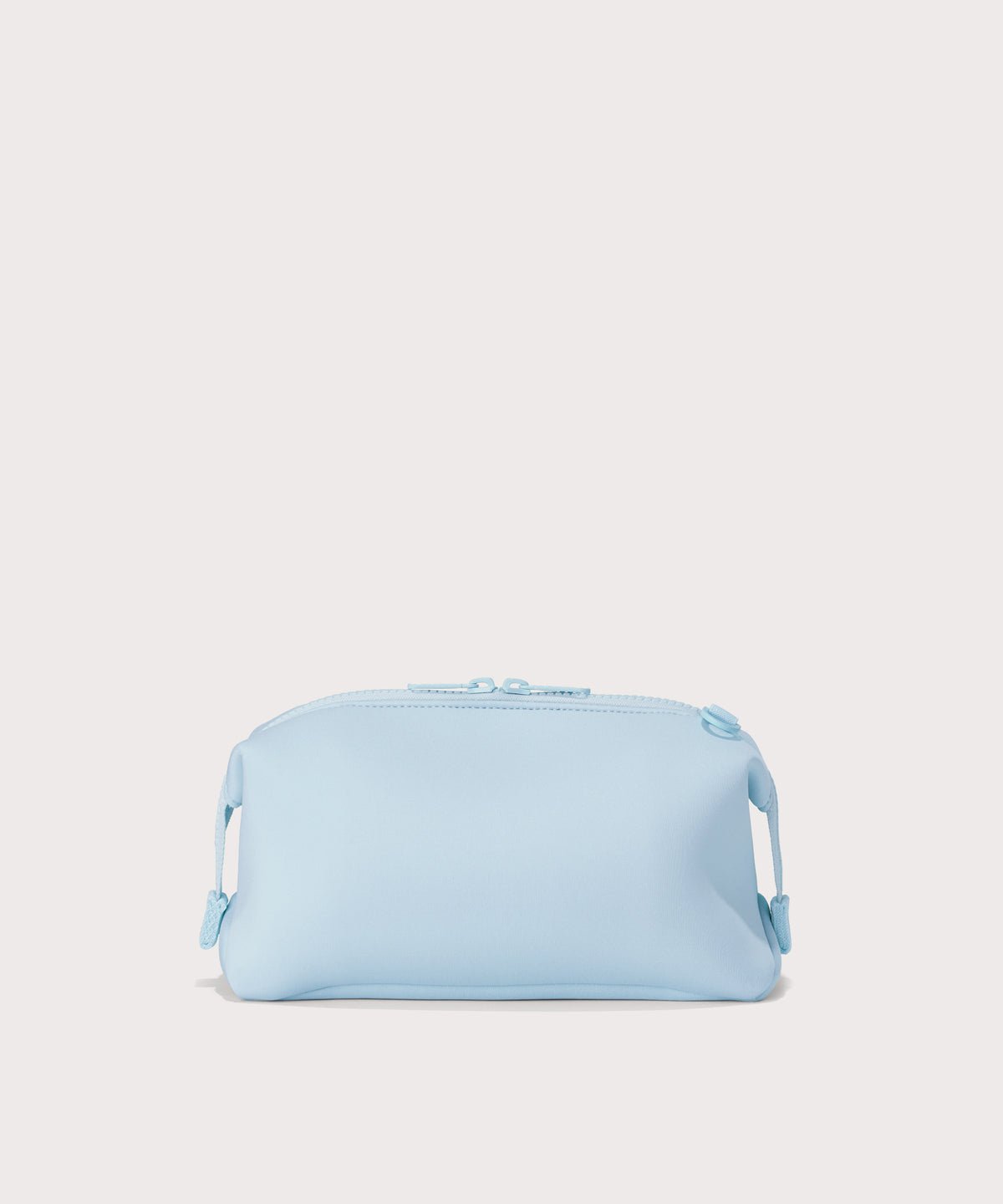 Dagne Dover large Hunter Toiletry Bag in an airy, lighter sky blue seen from the back.
