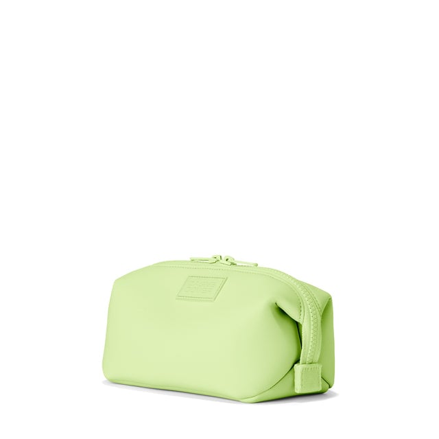 Dagne Dover Small Hunter Toiletry Bag in matcha green seen from an angle.