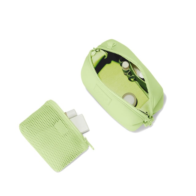 Dagne Dover Small Hunter Toiletry Bag in matcha green unzipped and seen from above with the removable air mesh pouch alongside it. hover
