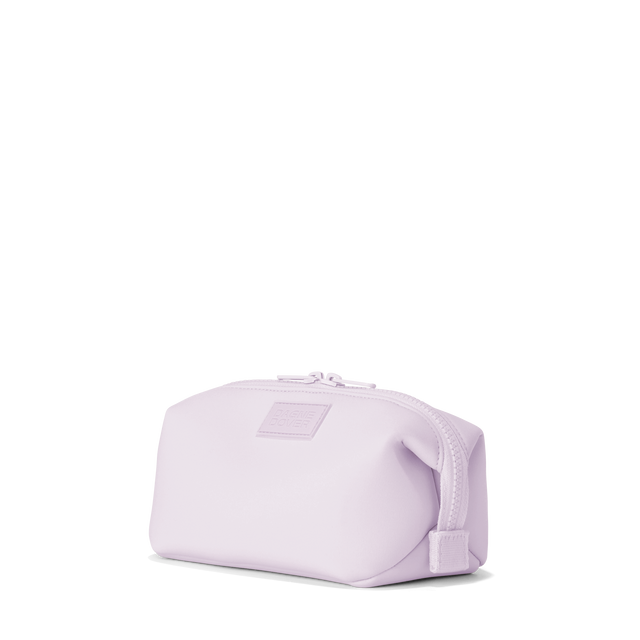Dagne Dover small Hunter Toiletry Bag in a soft purple with grey undertones seen from an angle.
