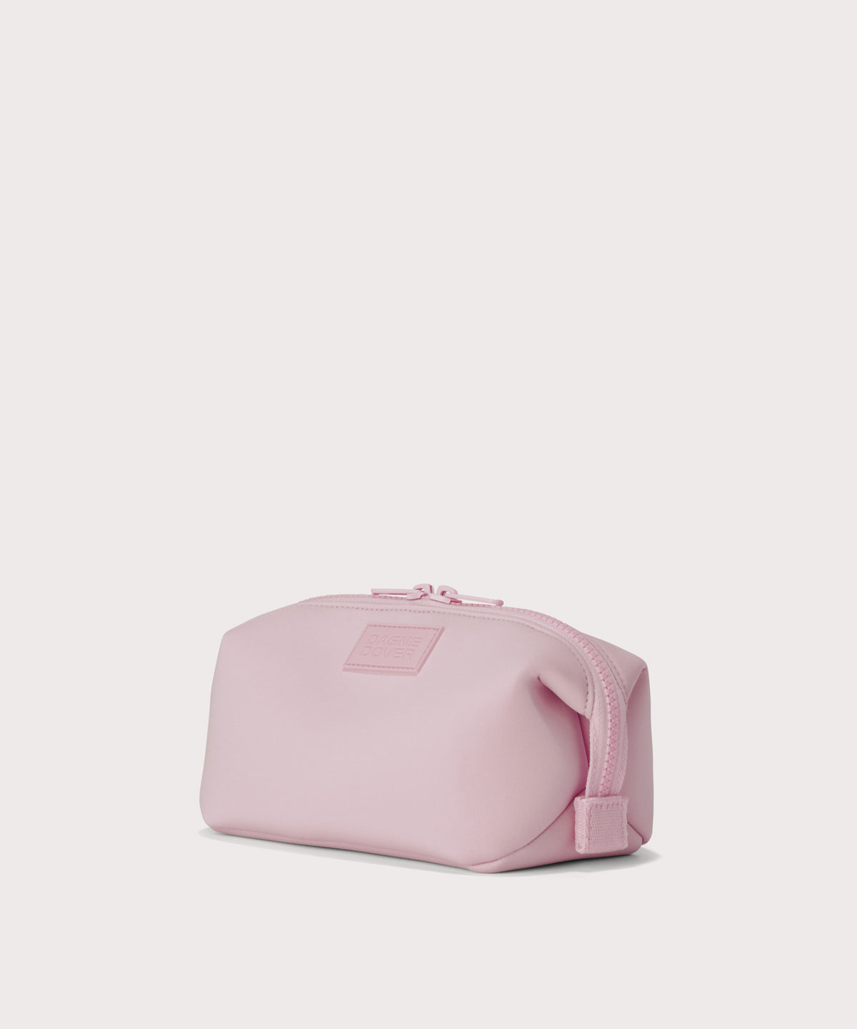 Hunter small toiletry bag in  cool, powdery pink with soft grey undertones Angle view. 
