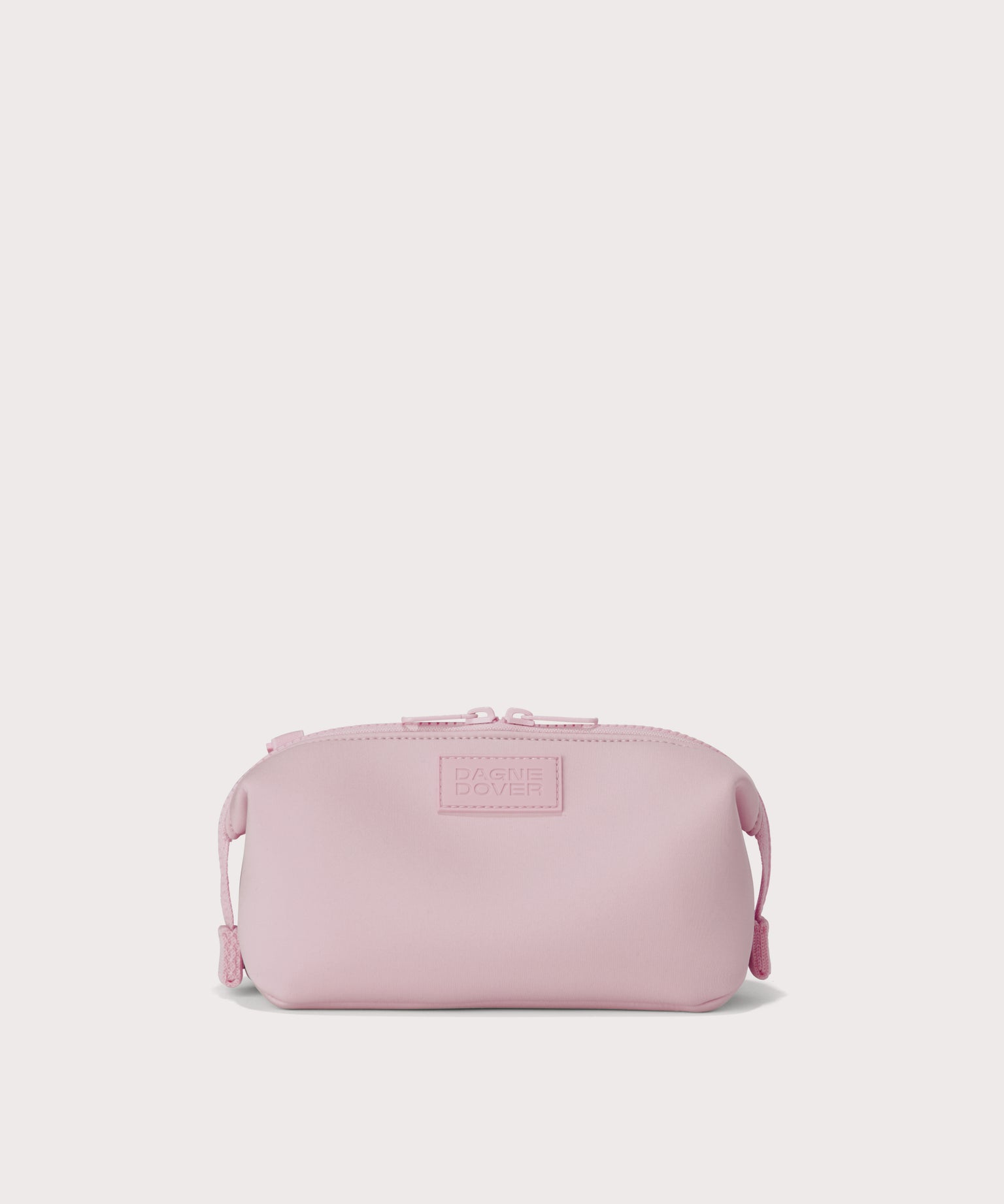 Hunter small toiletry bag in  cool, powdery pink with soft grey undertones. Front view. 
