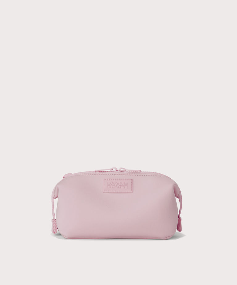 Hunter small toiletry bag in  cool, powdery pink with soft grey undertones. Front view. 
