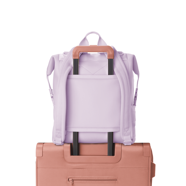 Dagne Dover Large Indi Diaper Backpack in a soft purple with grey undertones showing the neoprene luggage sleeve.
