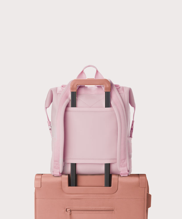 Large Indi backpack in a cool, powdery pink with soft grey undertones. displaying luggage sleeve
