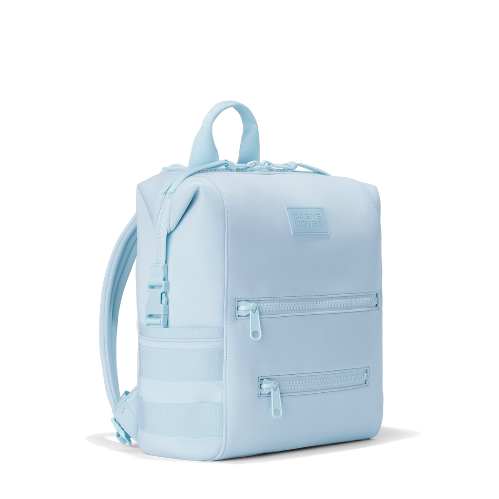 Dagne Dover medium Indi Diaper Backpack in an airy, lighter sky blue seen from an angle.
