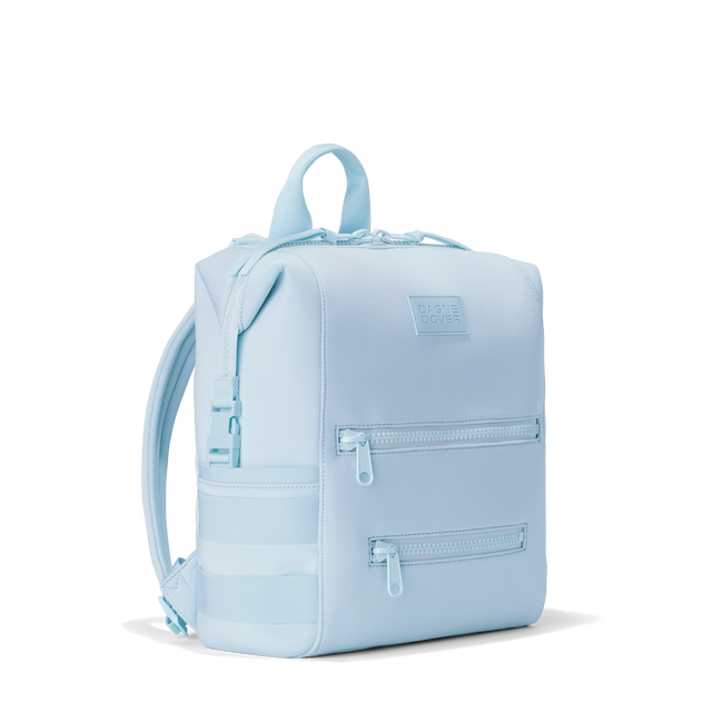 Dagne Dover medium Indi Diaper Backpack in an airy, lighter sky blue seen from an angle.

