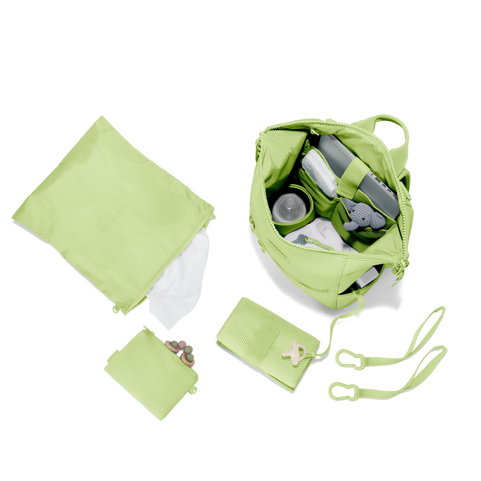 Dagne Dover Medium Indi Diaper Backpack in a vibrant, creamy green showing it's water resistant bag, interior pockets, and changing mat. Hover