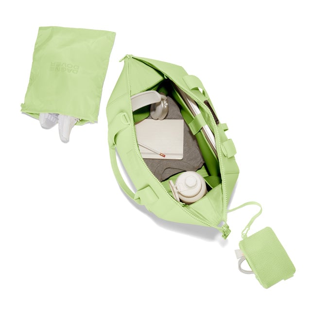 Dagne Dover Large Landon Carryall in a vibrant, creamy green unzipped, top down view. hover