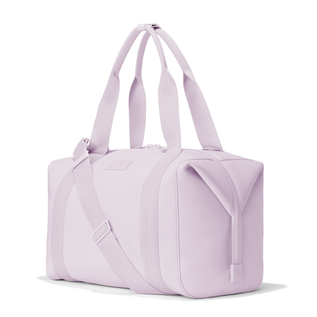 Dagne Dover large Landon Carryall in a soft purple with grey undertones, seen from an angle.
