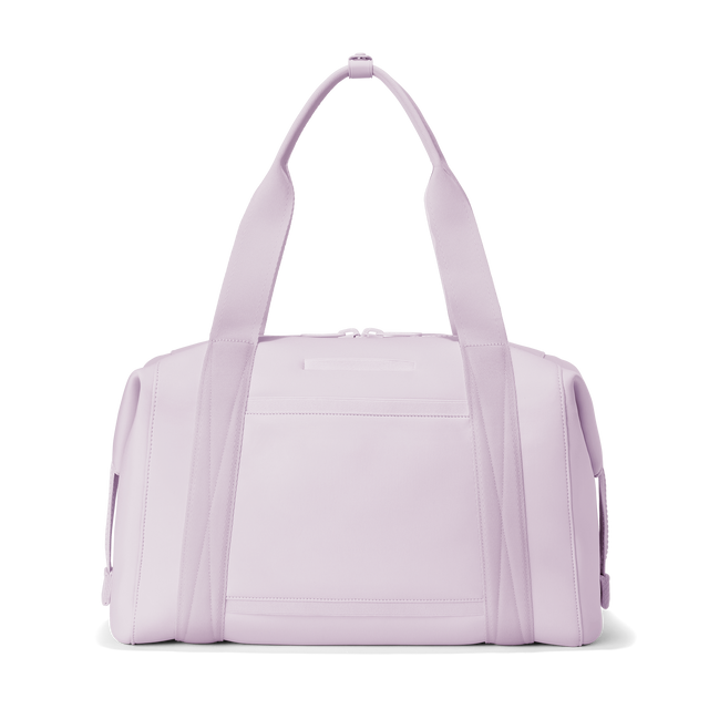 Dagne Dover large Landon Carryall in a soft purple with grey undertones seen from the back displaying an exterior phone pocket.
