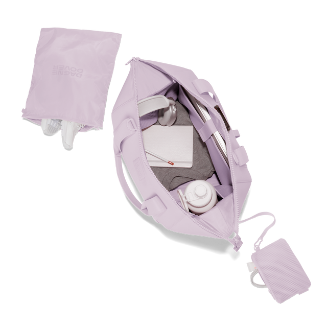 Dagne Dover large Landon Carryall in a soft purple with grey undertones unzipped, top down view. Hover
