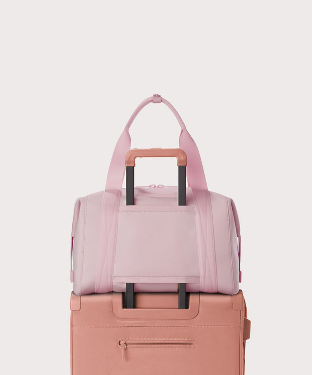  Large Landon Carryall in a cool, powdery pink with soft grey undertones displaying luggage sleeve
