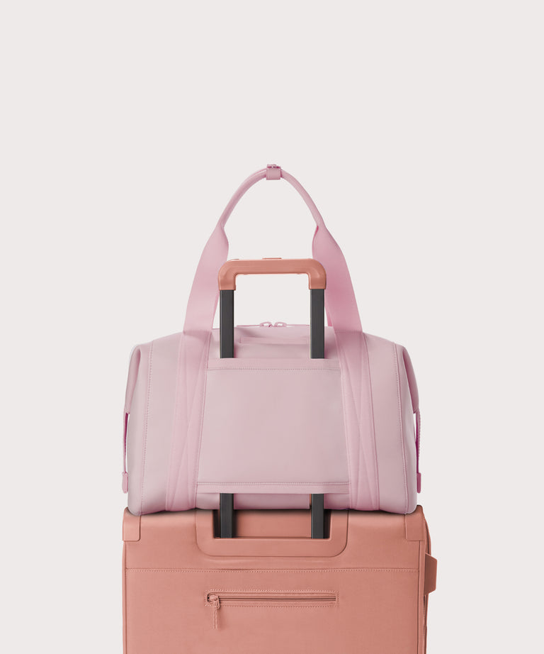  Large Landon Carryall in a cool, powdery pink with soft grey undertones displaying luggage sleeve
