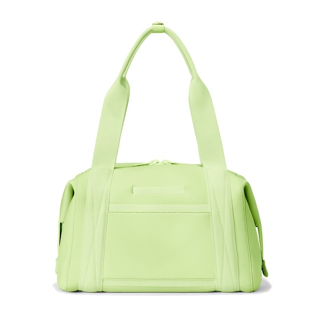 Dagne Dover Medium Landon Carryall in a vibrant, creamy green, seen from the back displaying an exterior phone pocket.