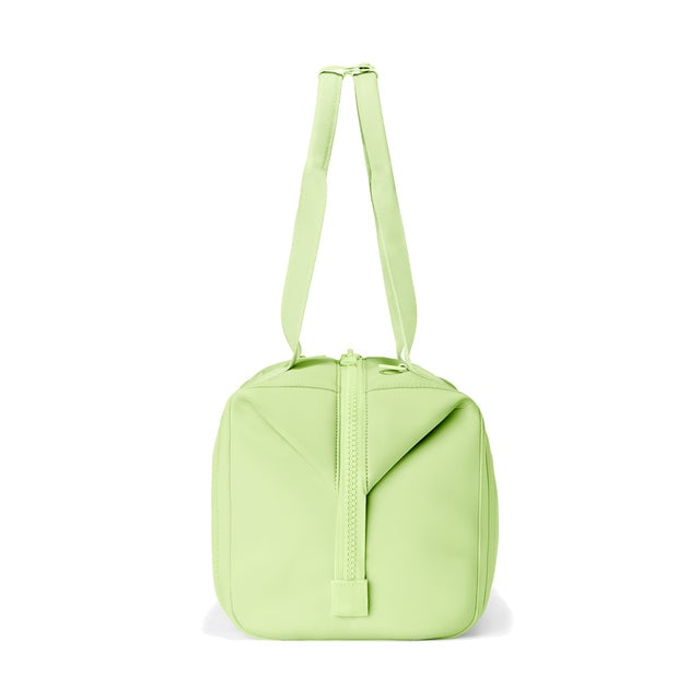 Dagne Dover Medium Landon Carryall in a vibrant, creamy green, seen from the side.