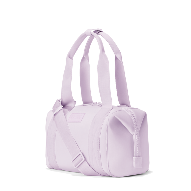 Dagne Dover small Landon Carryall in a soft purple with grey undertones, seen from an angle.
