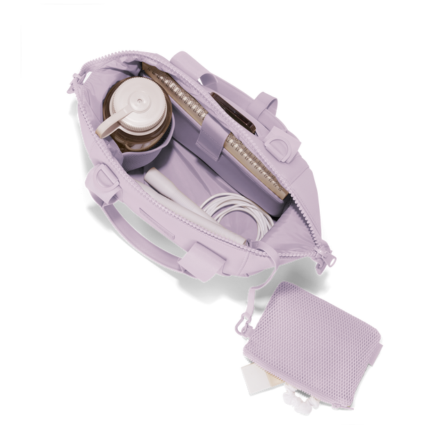 Dagne Dover small Landon Carryall in a soft purple with grey undertones unzipped, top down view. Hover

