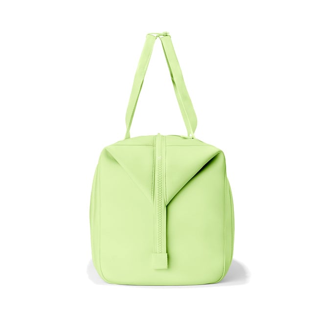 Dagne Dover Extra Large Landon Carryall in a vibrant, creamy green, seen from the side.