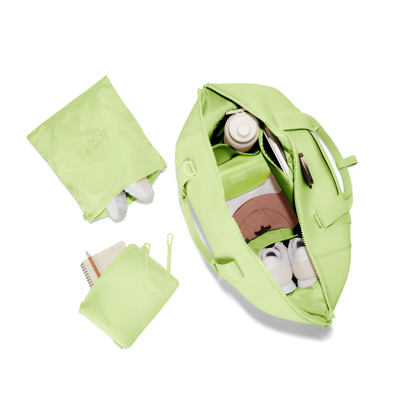 Dagne Dover Extra Large Landon Carryall in a vibrant, creamy green unzipped, top down view. hover