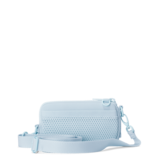 Dagne Dover Mara Phone Sling in an airy, lighter sky blue showing the exterior air mesh slip.
