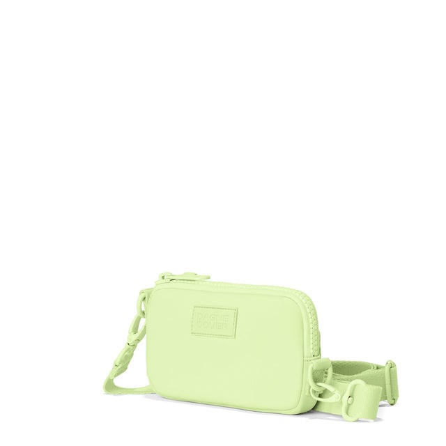 Dagne Dover Mara Phone Sling in matcha green seen from an angle, showing the adjustable shoulder strap drop.