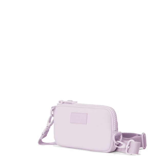 Dagne Dover Mara Phone Sling in a soft purple with grey undertones seen from an angle, showing the adjustable shoulder strap drop.
