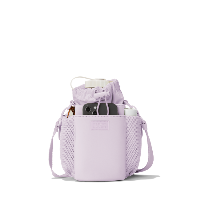 Dagne Dover Sloan Water Bottle Sling in a soft purple with grey undertones containing a water bottle and accessories.
