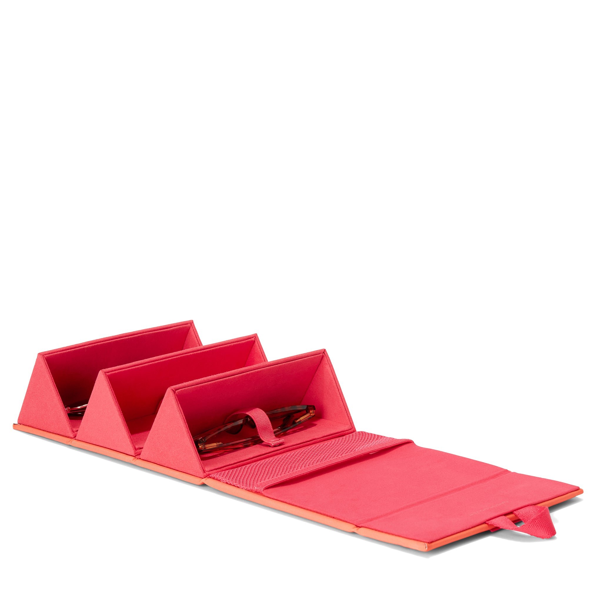 Dagne Dover Remi foldable glasses holder in a sun-bleached novelty treatment with fruit punch and pops of airbrushed orange, unfolded and containing sunglasses.