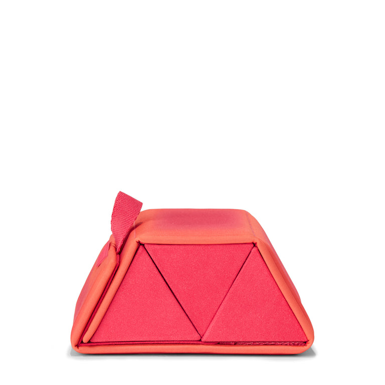 Dagne Dover Remi foldable glasses holder in dark a sun-bleached novelty treatment with fruit punch and pops of airbrushed orange seen from the side.