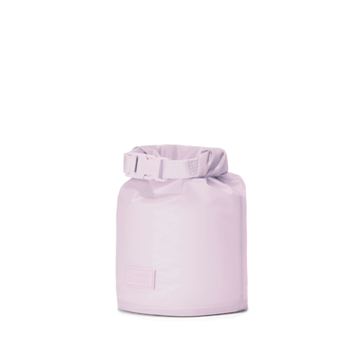 Dagne Dover Rae Roll-Top Dry Bag in a soft purple with grey undertones seen from an angle.