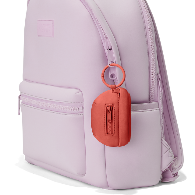 Dagne Dover Ace Keychain in a poppy, vintage wash red clipped onto a backpack. hover