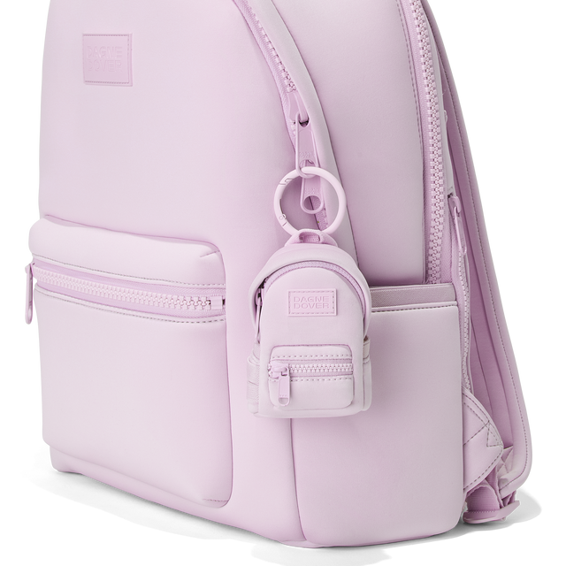 Dagne Dover Dakota Keychain in a soft purple with grey undertones clipped onto a backpack. hover
