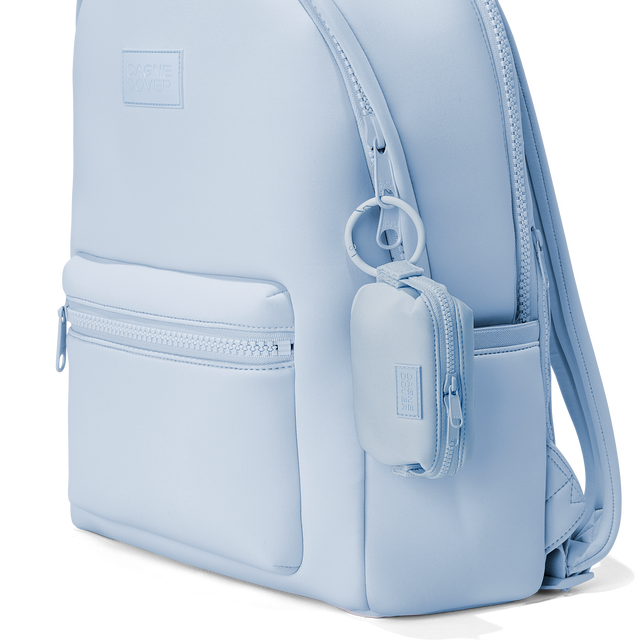 Dagne Dover Hunter Keychain in an airy, lighter sky blue clipped onto a backpack. hover

