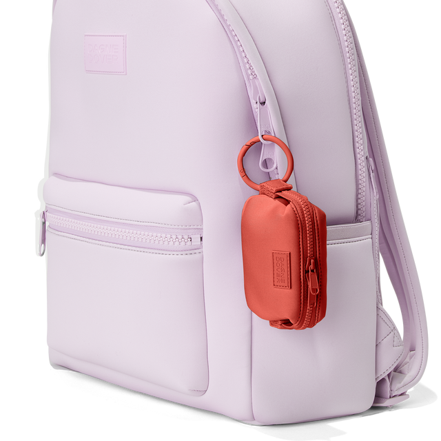 Dagne Dover Hunter Keychain in a poppy, vintage wash red clipped onto a backpack. hover