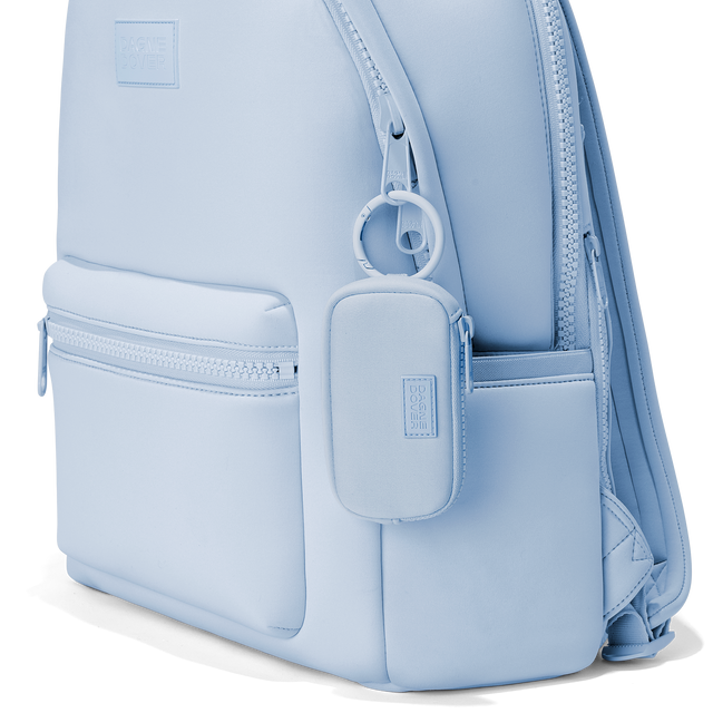 Dagne Dover Mara Keychain in an airy, lighter sky blue clipped onto a backpack. hover
