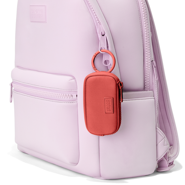 Dagne Dover Mara Keychain in a poppy, vintage wash red clipped onto a backpack. hover