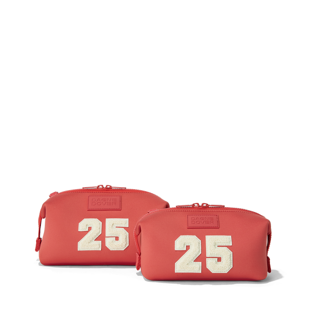 Dagne Dover Small and Large Hunter Toiletry Bags in a poppy, vintage wash red..
