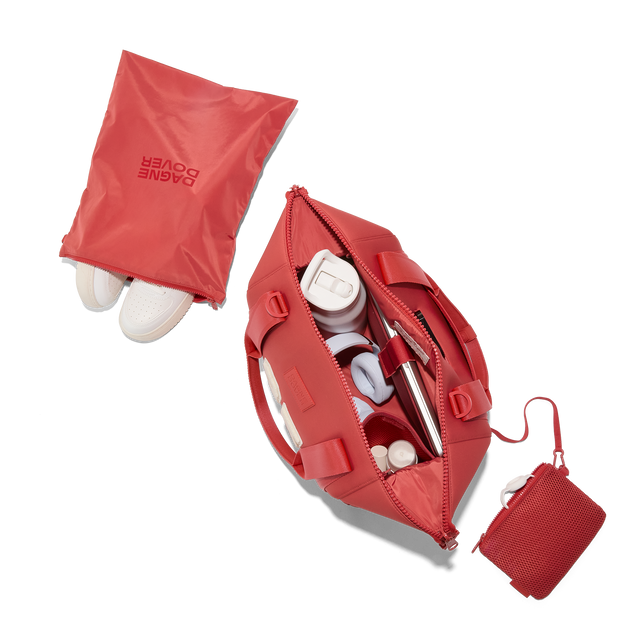 Dagne Dover medium Landon Carryall in a poppy, vintage wash red, unzipped, top down view. Hover
