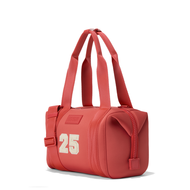 Dagne Dover small Landon Carryall in a poppy, vintage wash red, seen from an angle.
