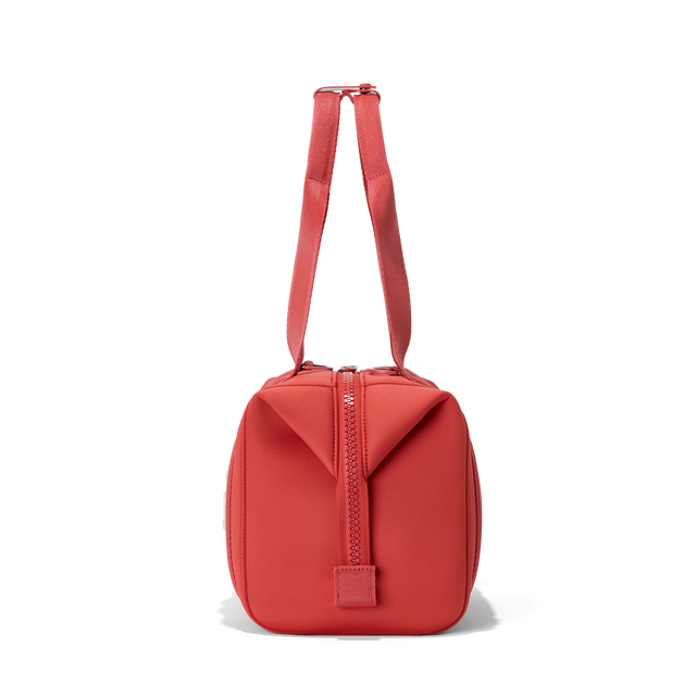 Dagne Dover small Landon Carryall in a poppy, vintage wash red, seen from the side.
