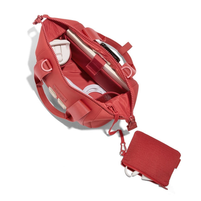 Dagne Dover small Landon Carryall in a poppy, vintage wash red, unzipped, top down view. Hover
