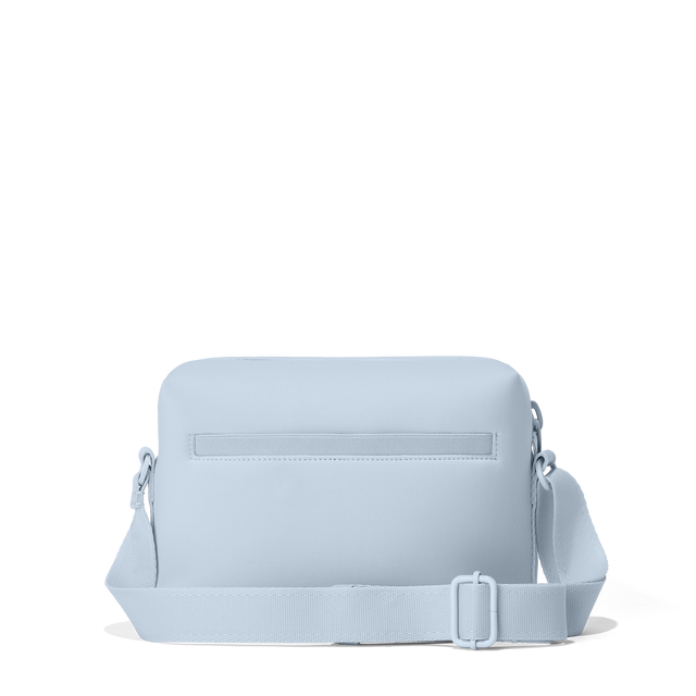 Dagne Dover Micah Crossbody in an airy, lighter sky blue seen from the back.
