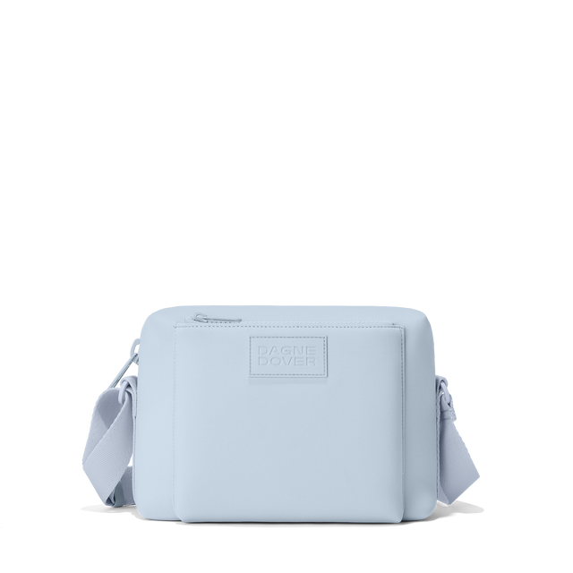 Dagne Dover Micah Crossbody in an airy, lighter sky blue.

